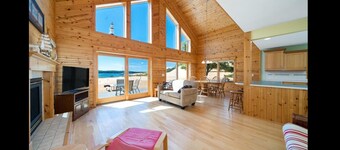 Lake frontage, Dune beach sand from deck to water! One of a kind.