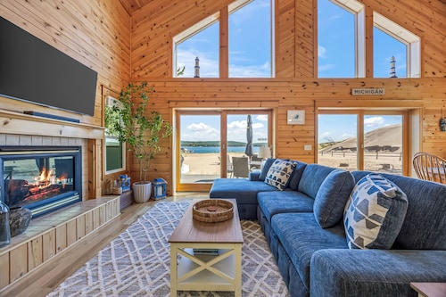 Lake frontage, Dune beach sand from deck to water! One of a kind.