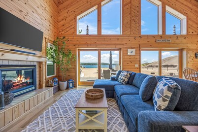 Lake frontage, Dune beach sand from deck to water! One of a kind.