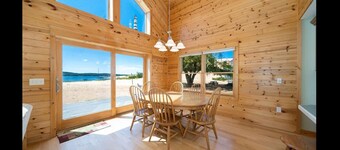 Lake frontage, Dune beach sand from deck to water! One of a kind.