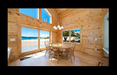 Lake frontage, Dune beach sand from deck to water! One of a kind.