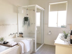 Bathtub, hair dryer, towels, soap