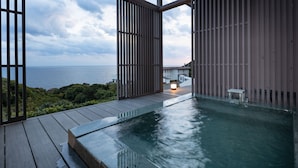 A wooden deck with a pool, overlooking a body of water and greenery. - TheMana Village (Tosashimizu)