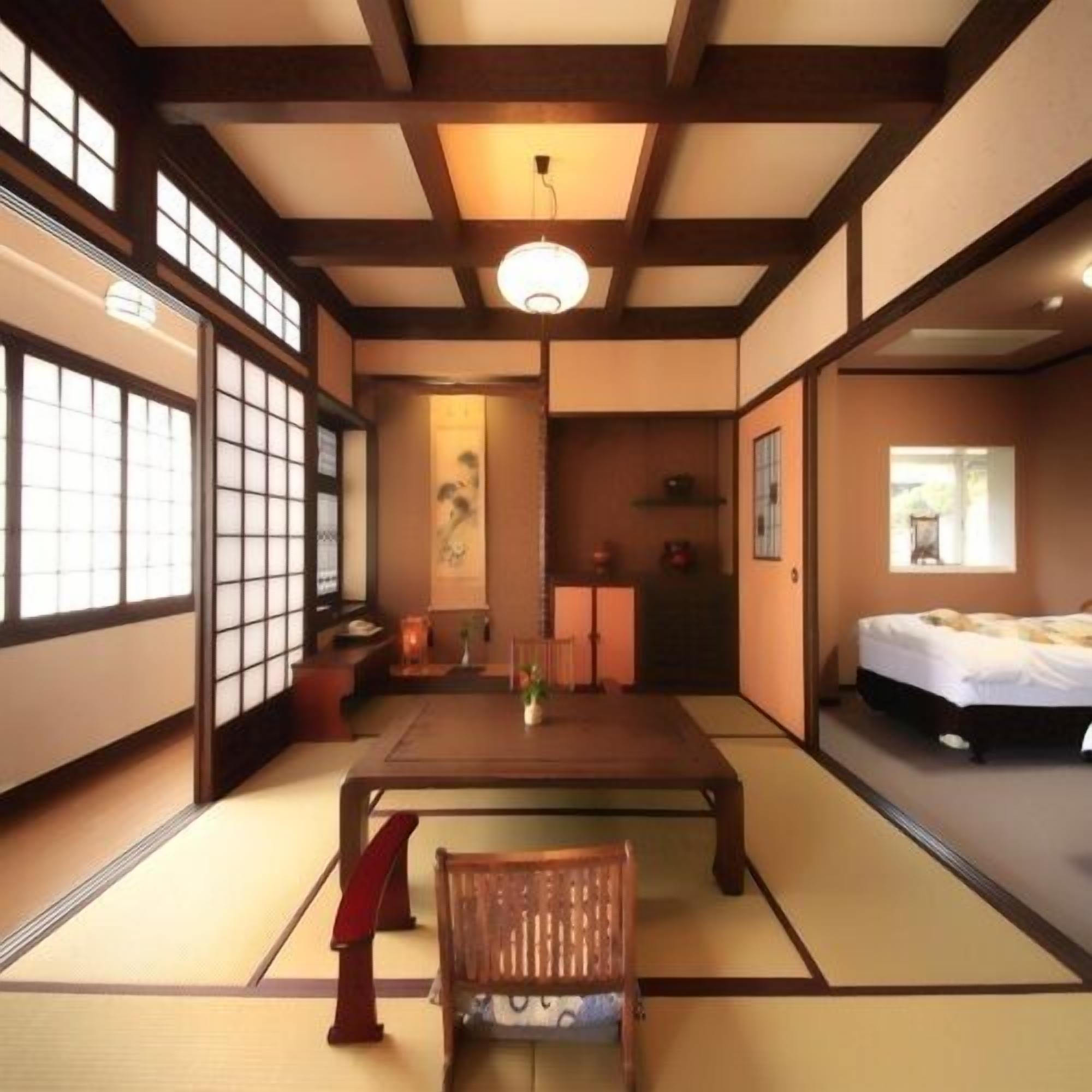 A traditional Japanese room with tatami flooring, a low table, a chair, a bed, and sliding doors.