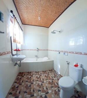 Separate tub and shower, deep soaking tub, rainfall showerhead, towels