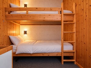 A bunk bed room with a ladder, wooden walls, and a small wall-mounted light. - 2-room apt, 6 ppl, pets allowed, Arc 1800 (Les Arcs 1800)