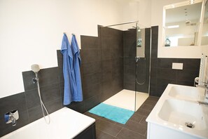 Bathtub, hair dryer, towels, soap
