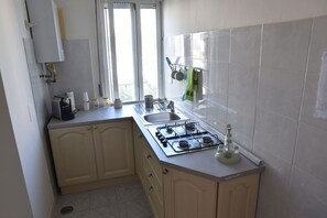 Fridge, microwave, stovetop, coffee/tea maker