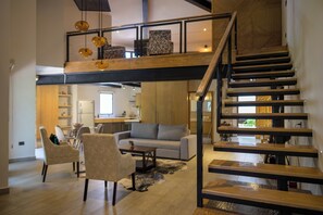 Elite Loft (Volterra) | Living area | 55-inch Smart TV with satellite channels, TV - Villa Toscana ValQuirico Lofts & Suites Hotel Boutique (Santeagueda)