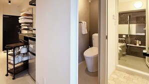 A modern bathroom with a shower, toilet, and a glass-enclosed shower area. - ORIGAMINN 601 by b hotel - 5 mins PeacePark (Hiroshima City)