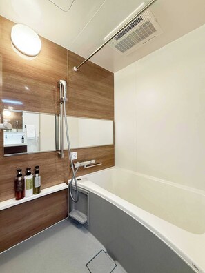 Bathtub, hair dryer, towels, soap