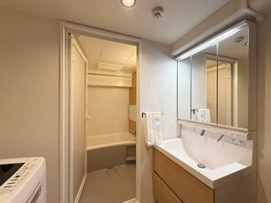 Bathtub, hair dryer, towels