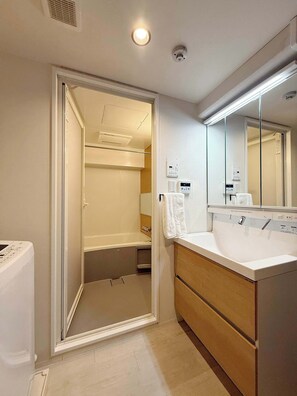 Bathtub, hair dryer, towels