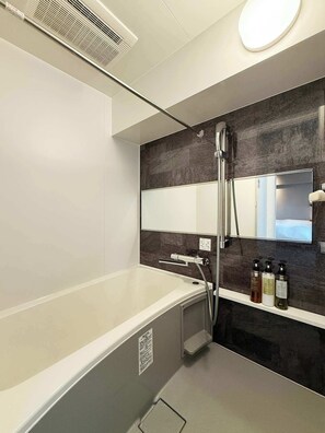 Bathtub, hair dryer, towels