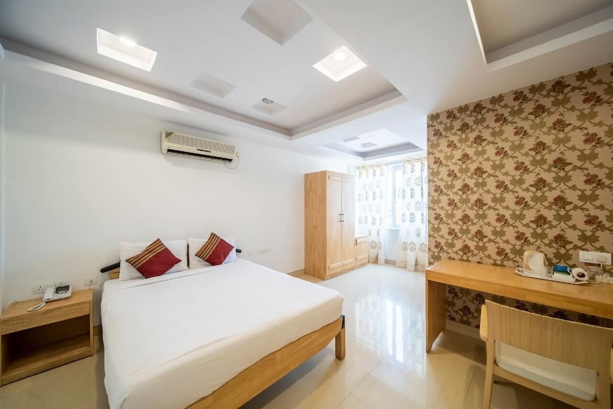 Habitación Deluxe con 1 cama matrimonial o 2 individuales | Minibar, escritorio, espacio para trabajar con laptop y insonorización