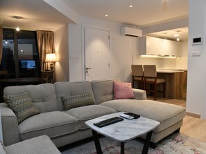 Superior Apartment | Living area | 50-inch flat-screen TV with cable channels, TV - Baz Tower (Nicosia)