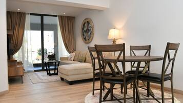 Superior Apartment, 2 Bedrooms | Living area | 50-inch flat-screen TV with cable channels, TV