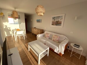 Apartment, 2 Bedrooms, Sea View | Living room | Flat-screen TV
