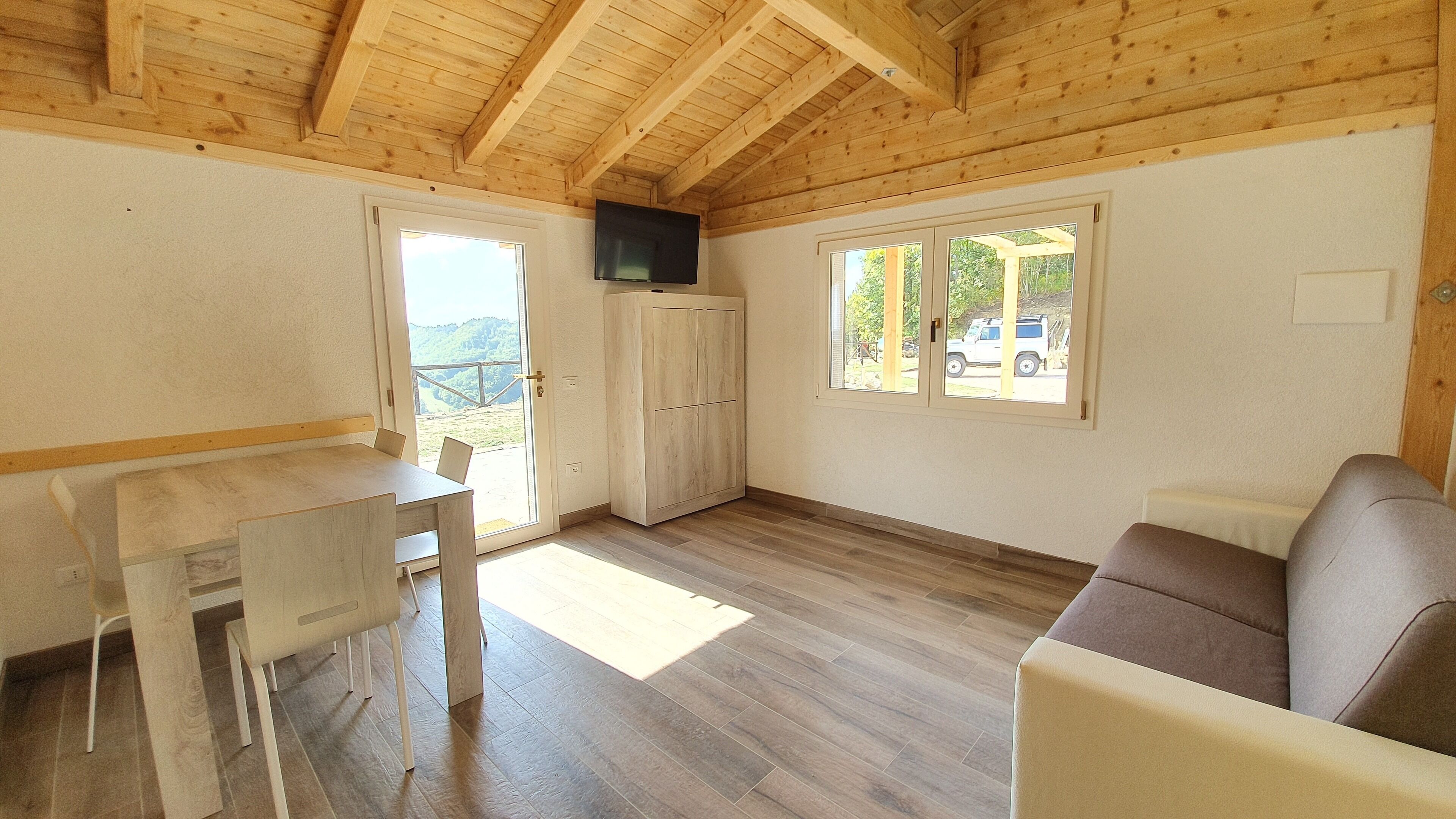 Quadruple Room (Paglia) | Living area | Flat-screen TV