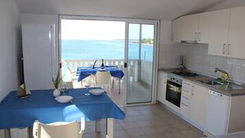Apartment, 1 Bedroom, Terrace, Sea View | Private kitchen | Fridge, oven, stovetop, dishwasher