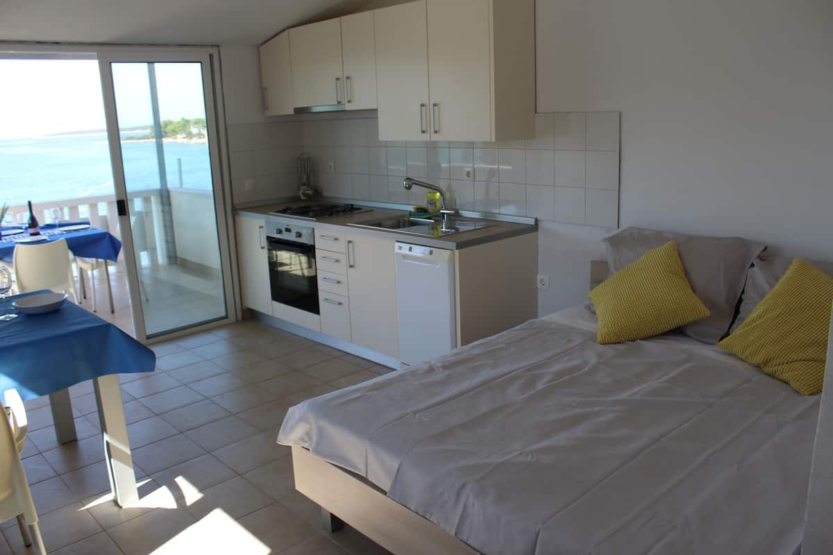 Apartment, 1 Bedroom, Terrace, Sea View | 1 bedroom, desk, WiFi (free), bed sheets