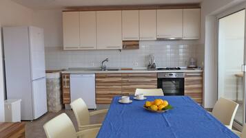 Villa | Private kitchen | Fridge, oven, stovetop, dishwasher
