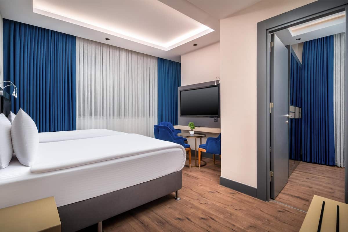 Chambre Deluxe, plusieurs lits, non-fumeurs | Draps en coton égyptien, literie de qualité supérieure