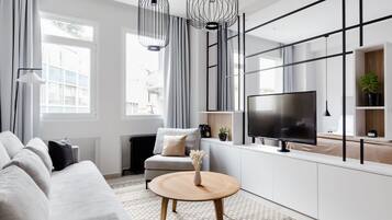 Apartment, 1 Bedroom (B) | Living area | 43-inch Smart TV with satellite channels, TV, Netflix