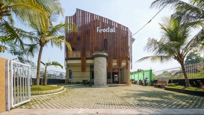 A building with a modern design, featuring a prominent name 'Feodal' on the facade. - RedDoorz near UMY Yogyakarta 3 (Sleman)