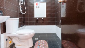 A bathroom with a toilet, sink, and shower. - RedDoorz near Caticlan Airport (Malay)