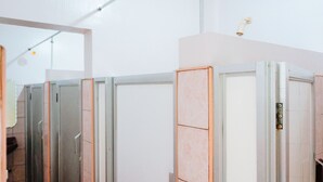 A row of hotel rooms with a uniform design, featuring a central door and a small window on the upper half of the door. - RedDoorz near Old Tagbilaran Airport (Tagbilaran)
