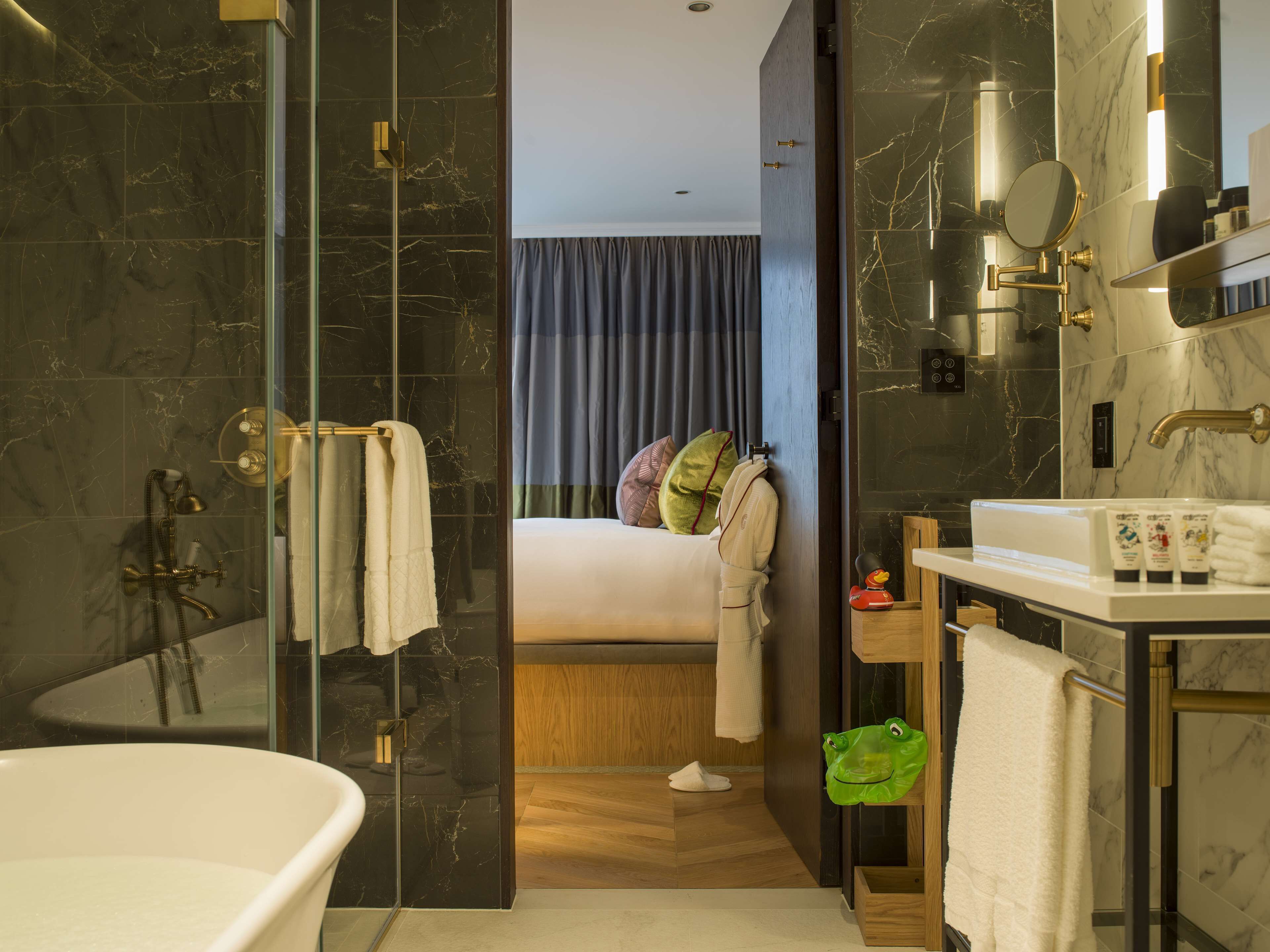 executive double room | bathroom | shower, designer toiletries, hair dryer, bathrobes