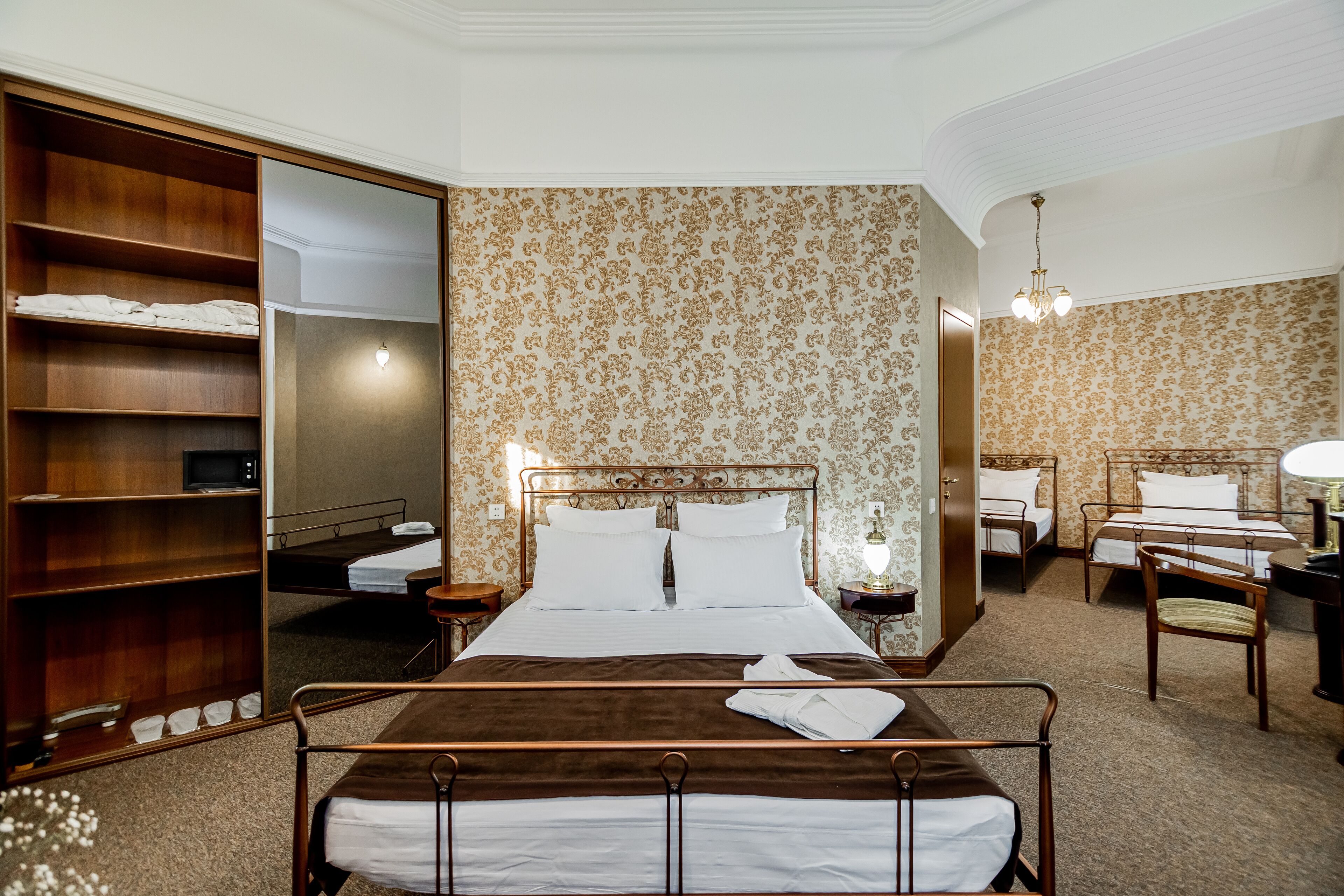 family room | minibar, in-room safe, desk, blackout curtains