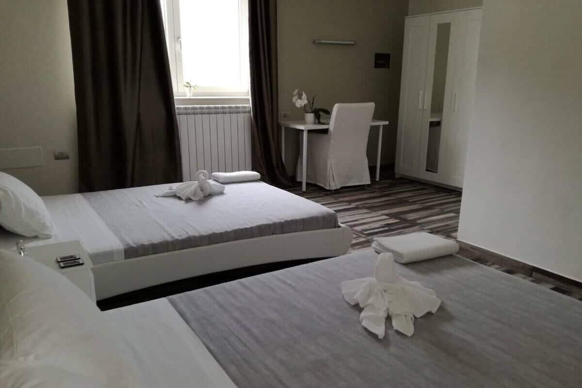 Deluxe Quadruple Room | In-room safe, blackout curtains, free WiFi, bed sheets