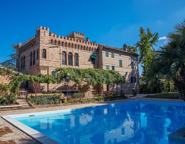 Seasonal outdoor pool, open 9:00 AM to 8:00 PM, pool umbrellas
