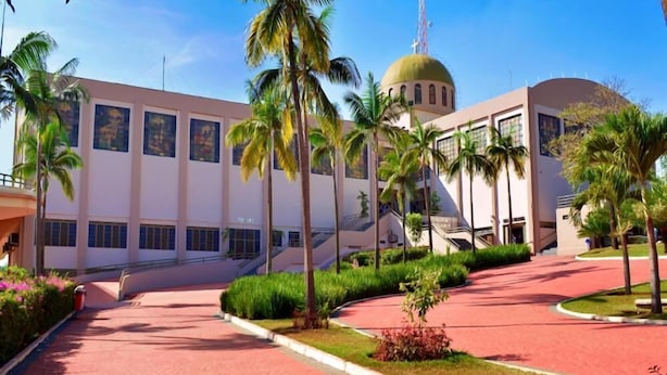 A modern building with a dome and a large staircase leading to the entrance. - Pousada Santana (Trindade)