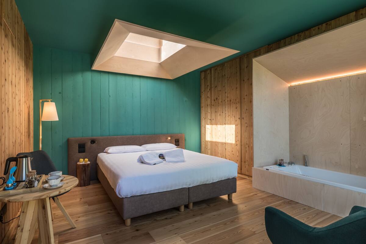 Junior Suite, Jetted Tub (Natural Romance) | Minibar, blackout drapes, WiFi (free), individually decorated