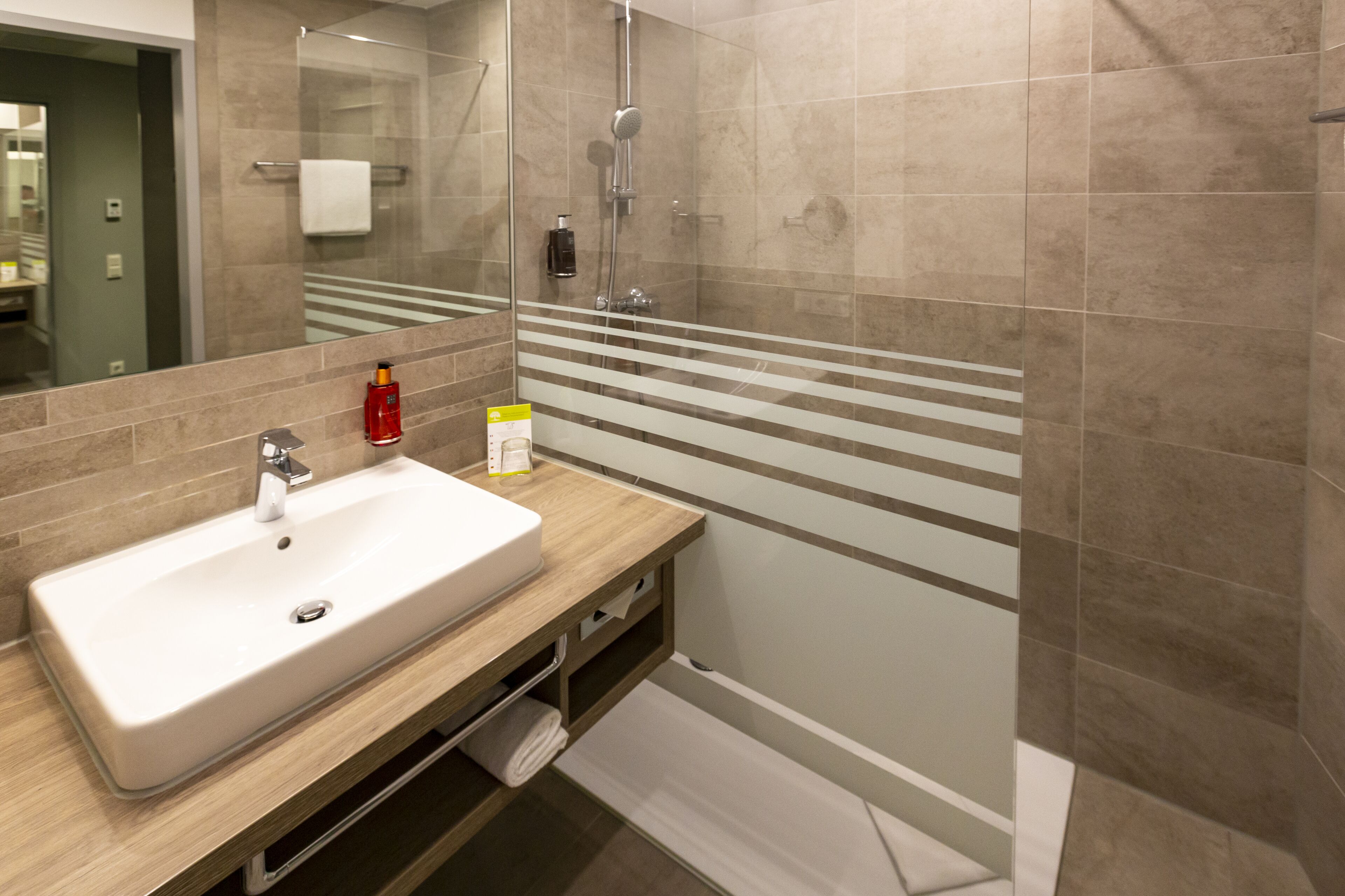 shower, eco-friendly toiletries, hair dryer, slippers