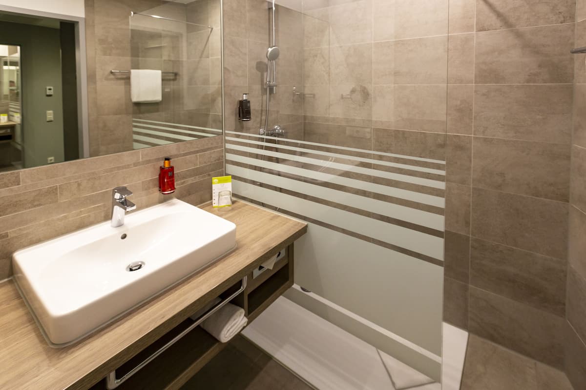 shower, eco-friendly toiletries, hair dryer, slippers