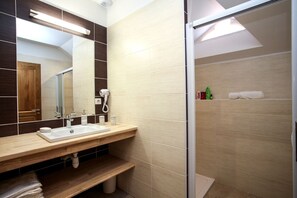 Bathtub, hair dryer, towels, soap