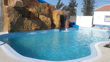 Outdoor pool, open 8:00 AM to midnight, pool loungers