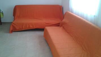 Deluxe Apartment, 1 Bedroom, Pool View | Living area | Flat-screen TV