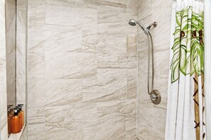 Combined shower/tub, hair dryer, towels, soap