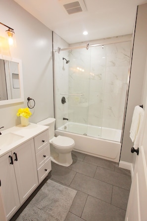 Combined shower/tub, hair dryer, towels, soap