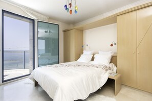 Apartment, Pool Access, Oceanfront | 2 bedrooms, laptop workspace, blackout drapes, iron/ironing board