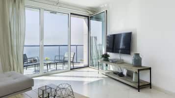 Apartment, 2 Bedrooms, Beachfront | Living area | Flat-screen TV
