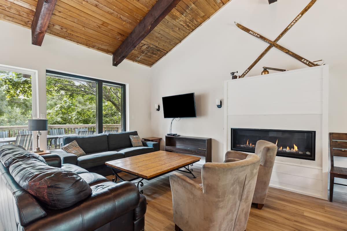 Classic Chalet, 4 Bedrooms (BV 9 -Tyrolean Chalet, No Pool Access) | Living area | Flat-screen TV, fireplace, DVD player