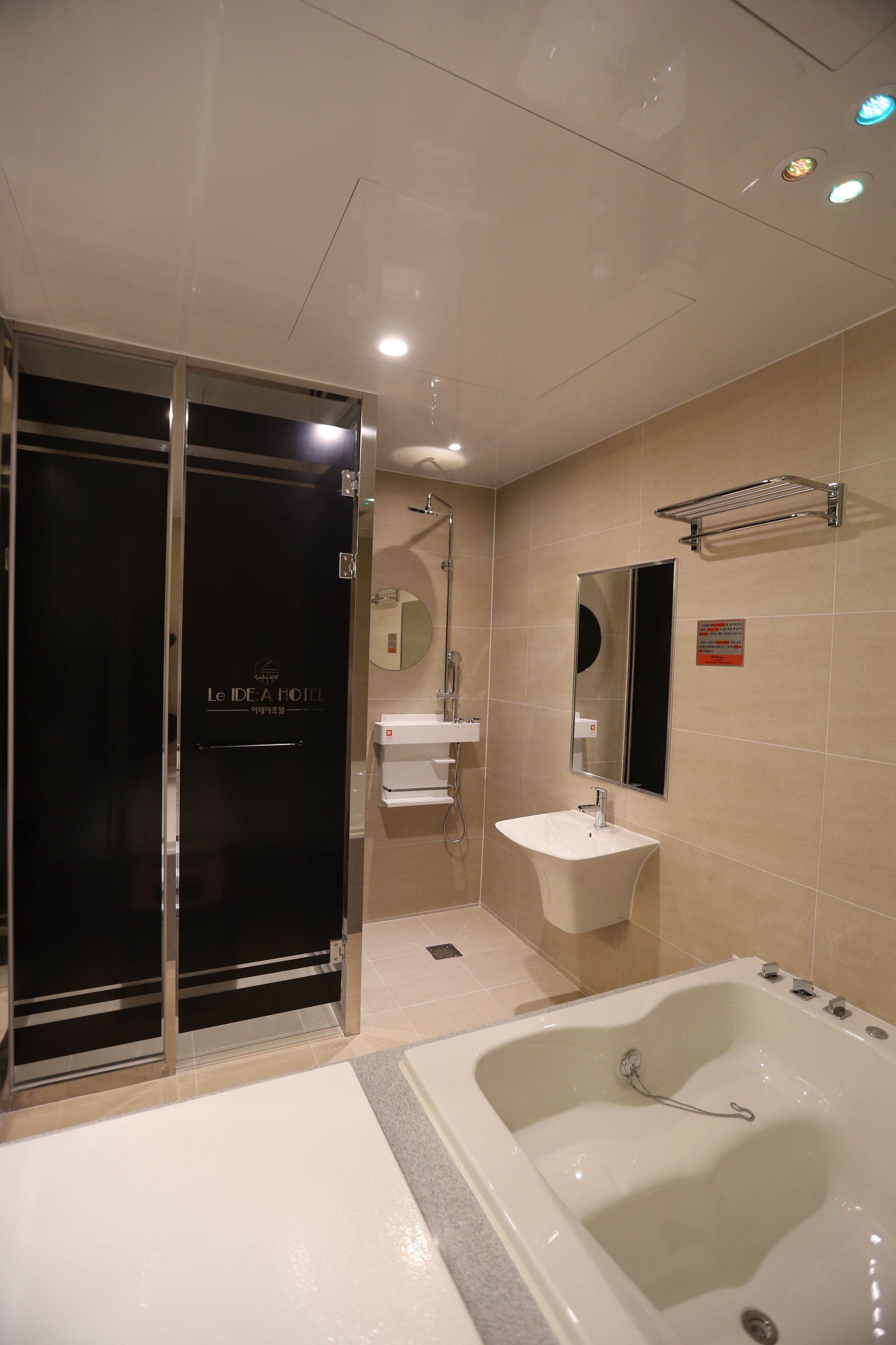 separate bathtub and shower, deep-soaking bathtub, rainfall showerhead