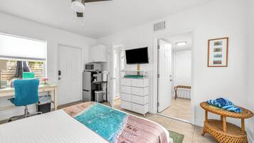 1 bedroom, desk, iron/ironing board, travel crib