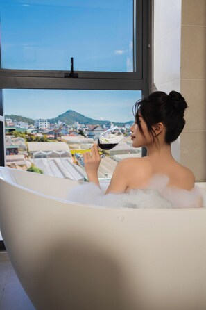 Premium Double Room | Bathroom amenities | Separate bathtub and shower, rainfall showerhead, designer toiletries - Canary Dalat Hotel (Da Lat)